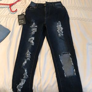 Dark wash ripped up fashion nova skinny jeans